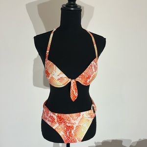 Orange and white snake skin patterned bikini set by Victoria secret.